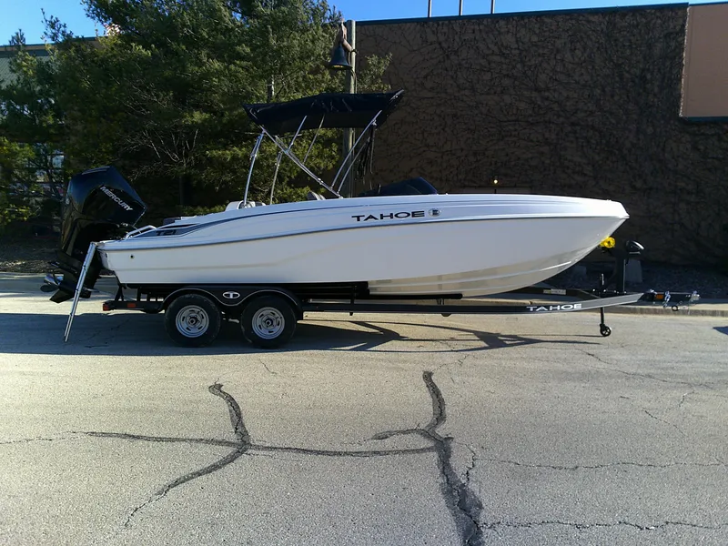 The Image of 2024 Tahoe T21 boat on trailer in parking lot. - 0
