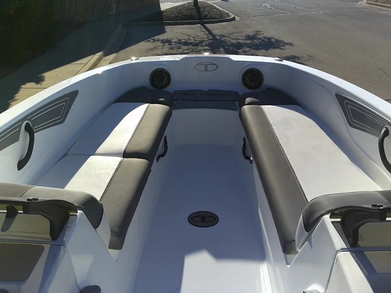 Slide: The Image of 2024 Tahoe T21 boat interior with cushioned seating and modern design. - 5