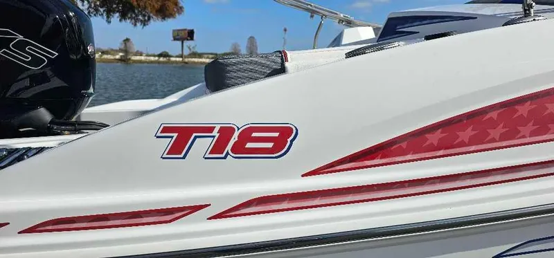 Slide: The Image of 2024 Tahoe T18 boat with red and blue graphics on the side. - 4