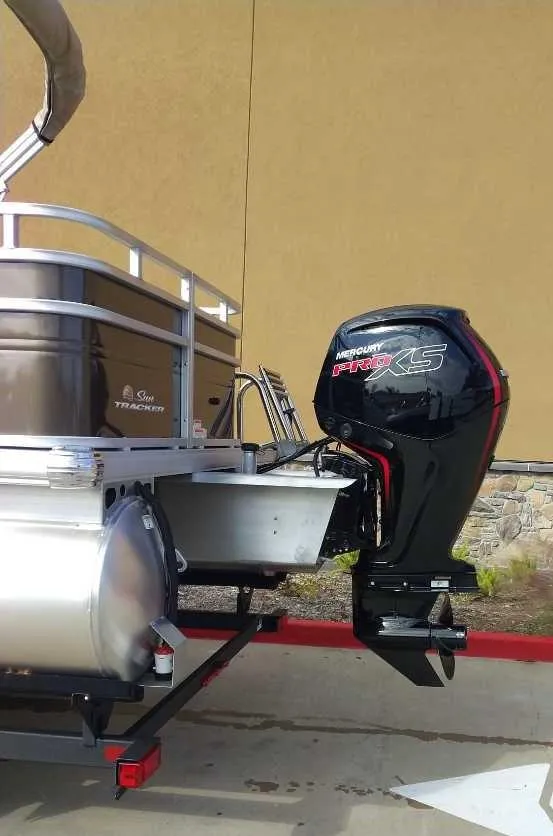 Slide: The Image of 2024 Sun Tracker SportFish 22 DLX pontoon boat with powerful outboard motor. - 3