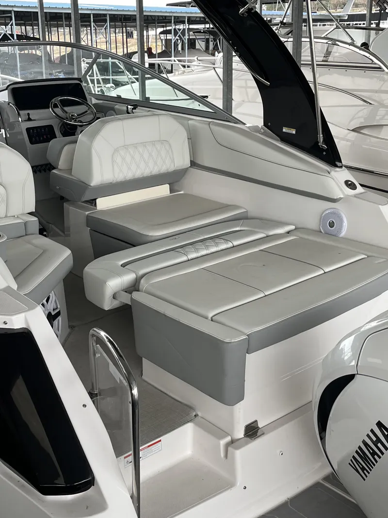 Slide: The Image of 2022 Regal 26XO boat interior with plush seating and modern design. - 14