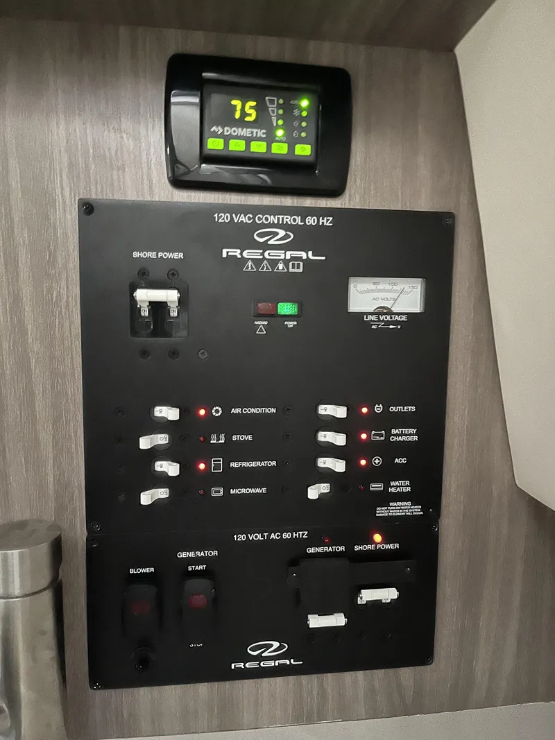 Slide: The Image of Control panel of a 2022 Regal 26XO boat with Dometic thermostat. - 5