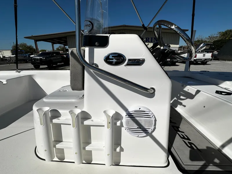 Slide: The Image of 2024 Sea Pro 172 Bay boat console with rod holders and steering wheel. - 10