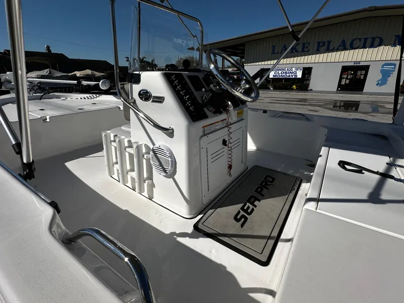 Slide: The Image of 2024 Sea Pro 172 Bay boat interior with steering console and Sea Pro mat. - 11
