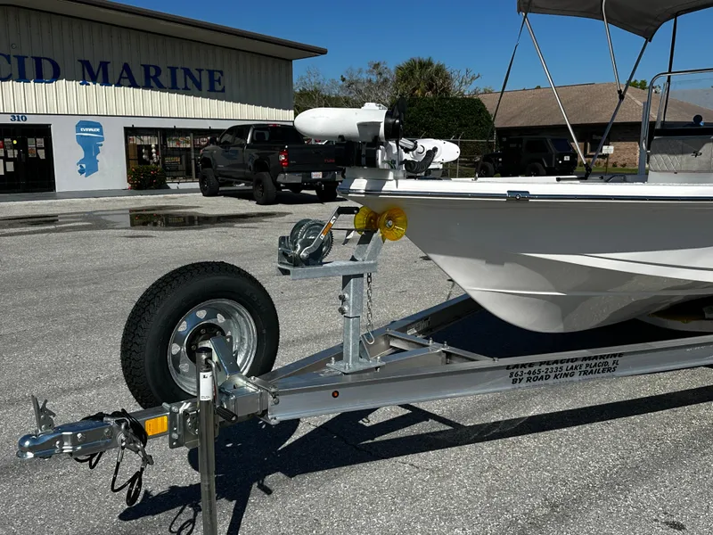 Slide: The Image of 2024 Sea Pro 172 Bay boat on trailer outside marine dealership. - 17