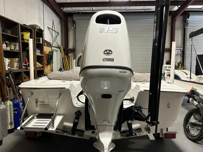 Slide: The Image of 2024 Sea Pro 172 Bay boat with 115 HP engine in a garage. - 18