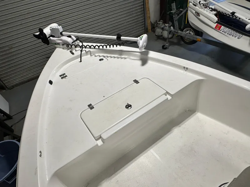 Slide: The Image of 2024 Sea Pro 172 Bay boat with trolling motor and storage compartment. - 20