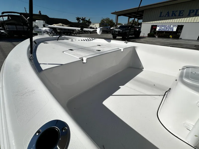 Slide: The Image of 2024 Sea Pro 172 Bay boat interior, showcasing spacious deck and storage compartments. - 21