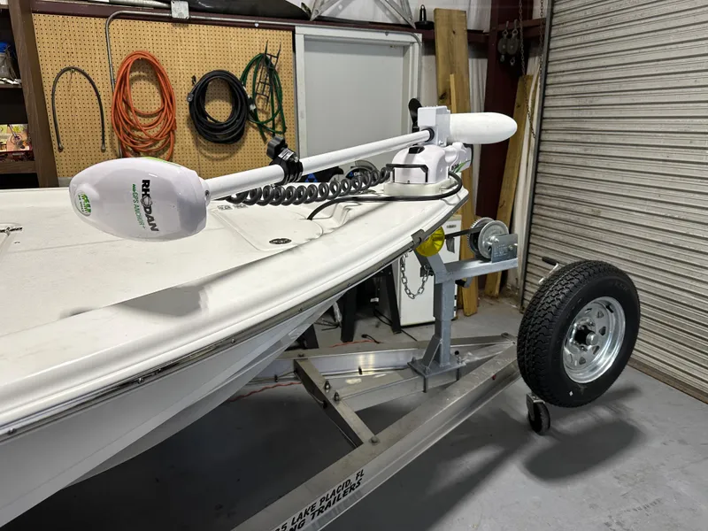 Slide: The Image of 2024 Sea Pro 172 Bay boat on trailer in garage. - 7