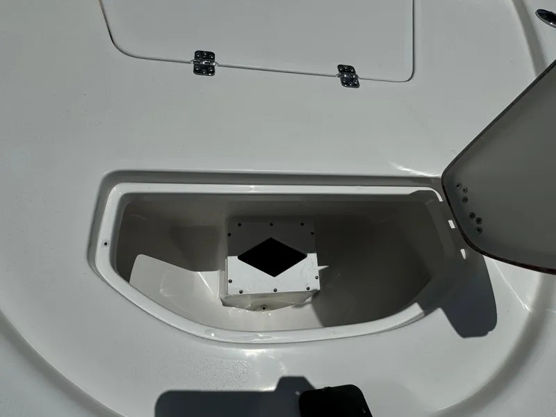 Slide: The Image of 2024 Sea Pro 230 Bay boat storage compartment with open hatch. - 10