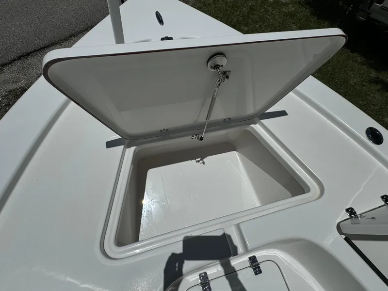 Slide: The Image of 2024 Sea Pro 230 Bay boat with open storage compartment. - 13