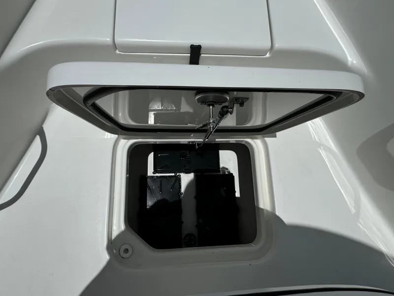 Slide: The Image of 2024 Sea Pro 230 Bay boat storage compartment with open hatch. - 14