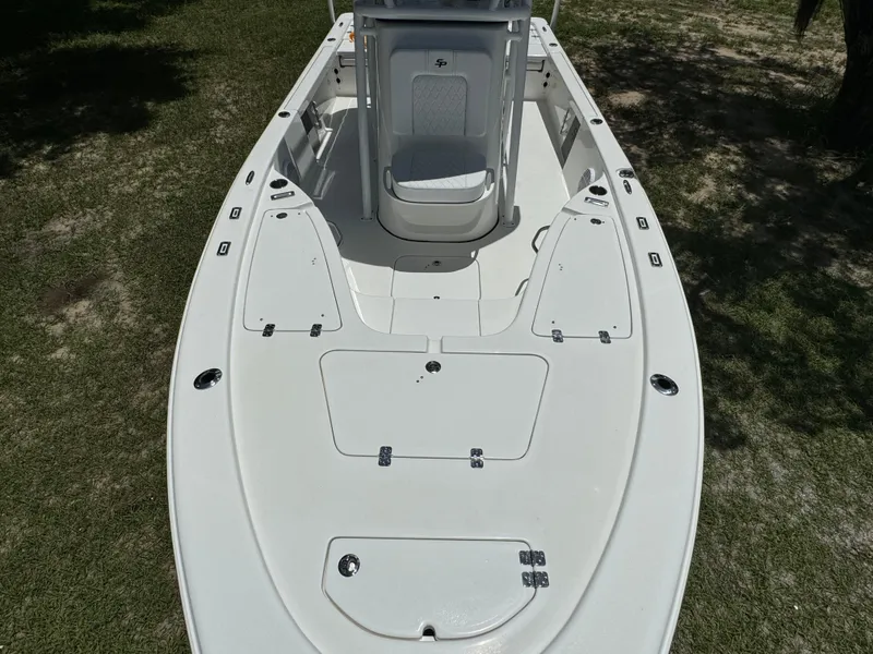 Slide: The Image of 2024 Sea Pro 230 Bay boat deck with storage compartments and seating. - 15