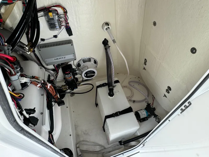 Slide: The Image of 2024 Sea Pro 230 Bay boat interior wiring and equipment setup. - 22