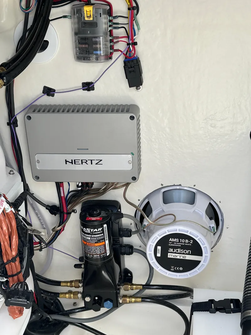 Slide: The Image of 2024 Sea Pro 230 Bay boat electronics and audio system components. - 24