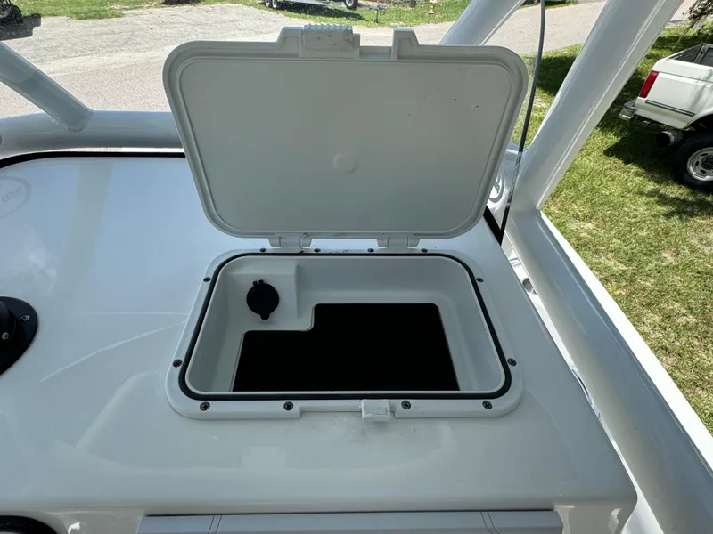 Slide: The Image of Open storage compartment on a 2024 Sea Pro 230 Bay boat. - 27