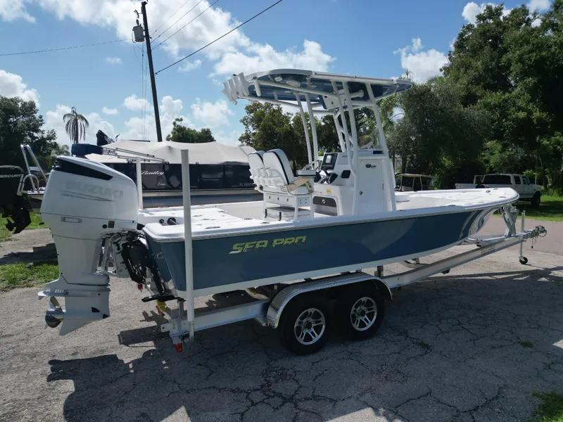 Slide: The Image of 2024 Sea Pro 230 Bay boat on a trailer, parked outdoors. - 3