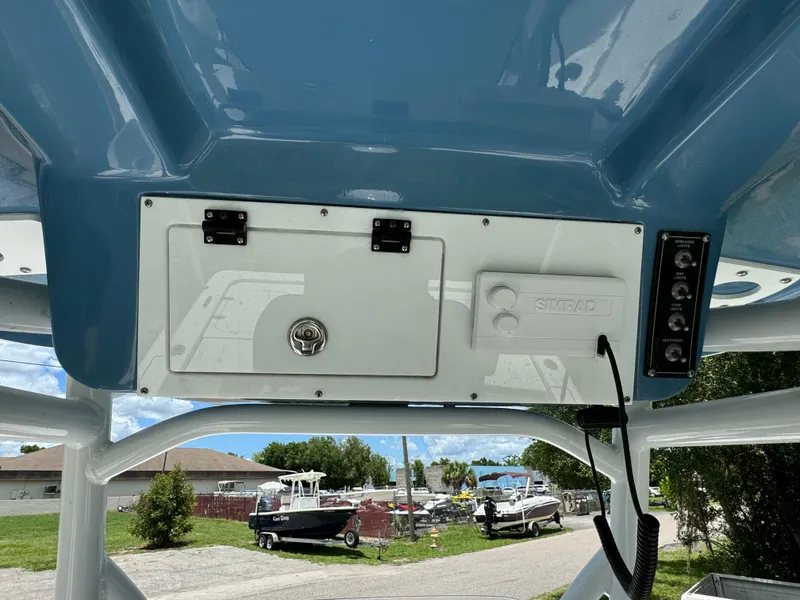 Slide: The Image of 2024 Sea Pro 230 Bay boat console with storage compartment and control panel. - 30