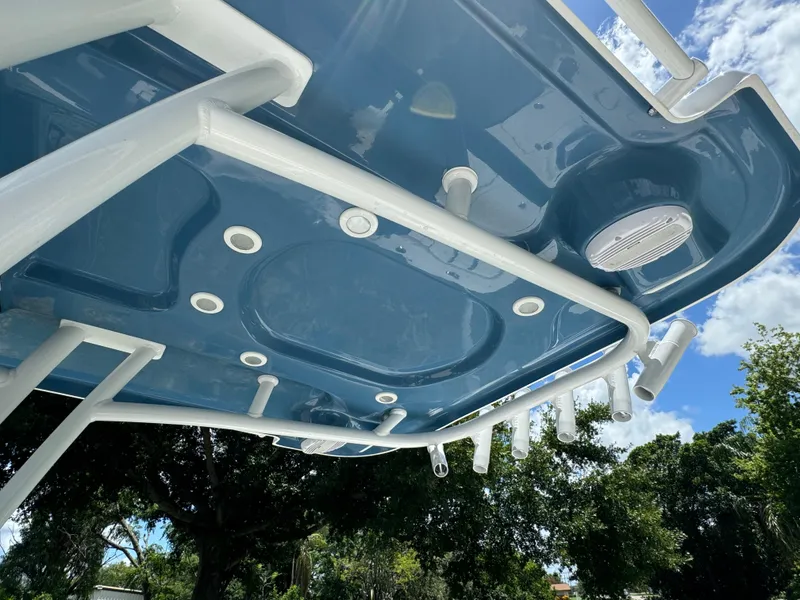 Slide: The Image of 2024 Sea Pro 230 Bay boat underside with rod holders and blue finish. - 32