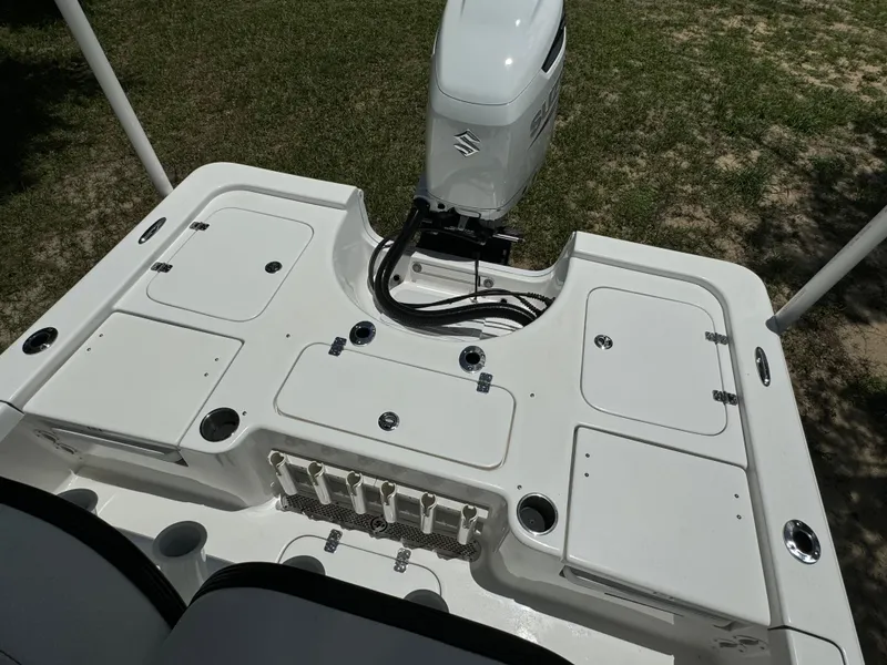 Slide: The Image of 2024 Sea Pro 230 Bay boat stern with storage compartments and outboard motor. - 39