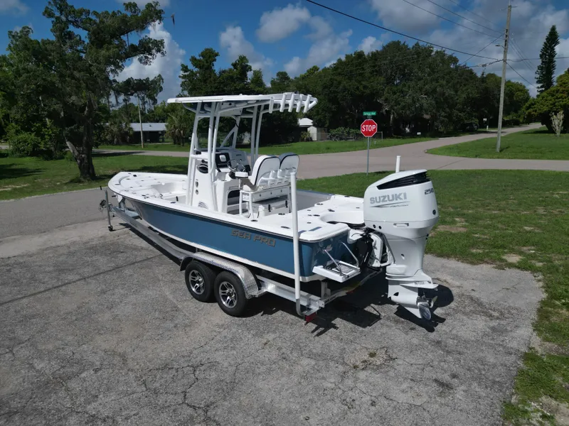Slide: The Image of 2024 Sea Pro 230 Bay boat on trailer with Suzuki outboard motor. - 4