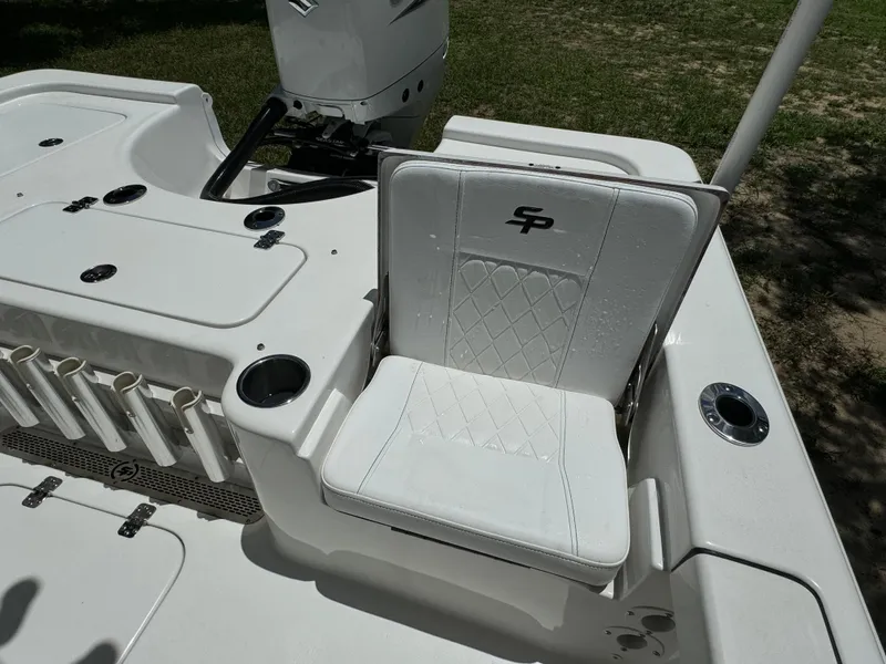 Slide: The Image of 2024 Sea Pro 230 Bay boat with white seating and fishing rod holders. - 42