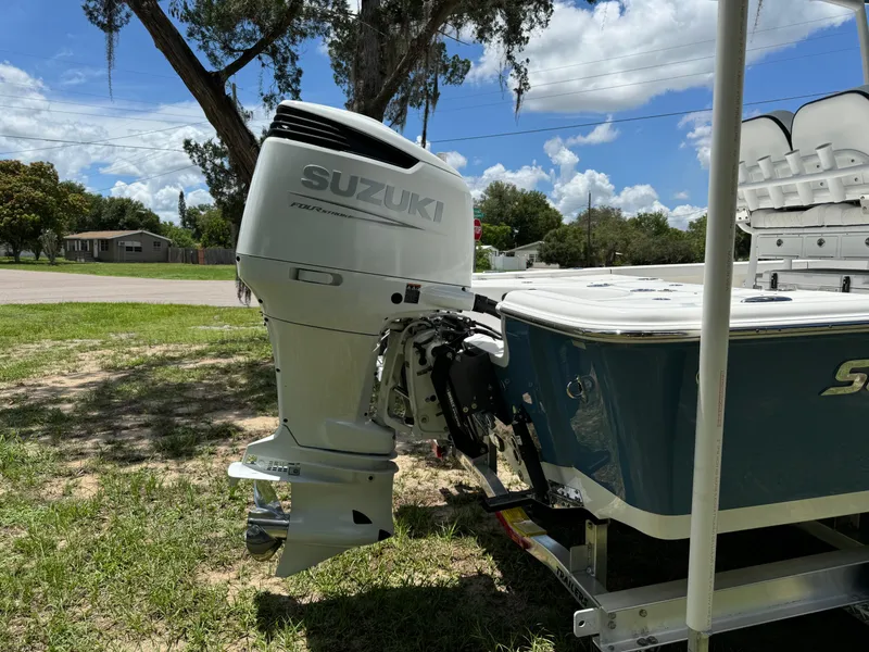 Slide: The Image of 2024 Sea Pro 230 Bay boat with Suzuki outboard motor on trailer. - 46