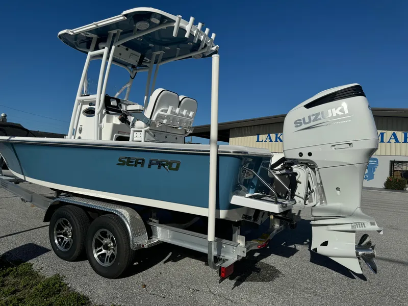 Slide: The Image of 2024 Sea Pro 230 Bay boat with Suzuki outboard motor on trailer. - 48