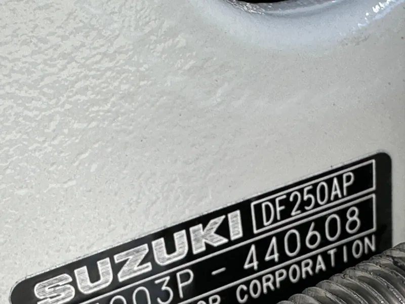 Slide: The Image of Close-up of Suzuki DF250AP engine label on 2024 Sea Pro 230 Bay boat. - 49