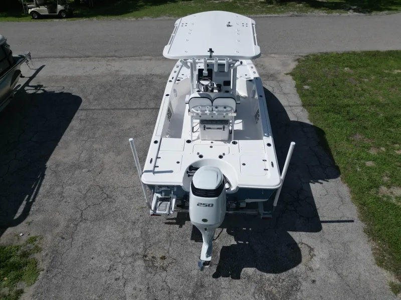 Slide: The Image of 2024 Sea Pro 230 Bay boat, aerial view, parked on pavement. - 5