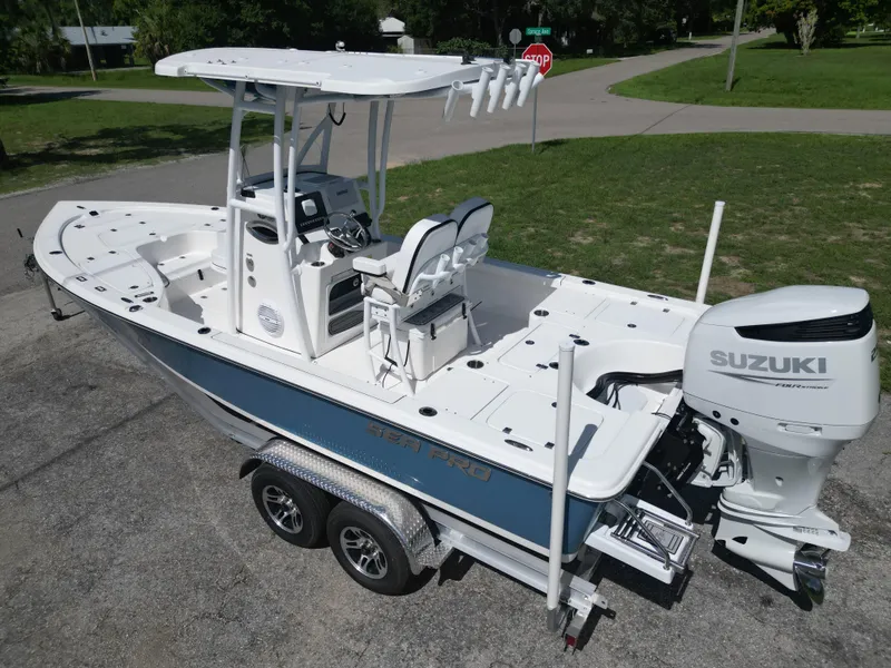 Slide: The Image of 2024 Sea Pro 230 Bay boat with Suzuki outboard motor on trailer. - 6