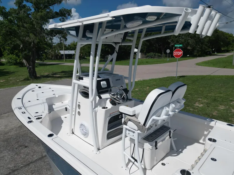 Slide: The Image of 2024 Sea Pro 230 Bay boat with T-top and dual helm seats. - 7