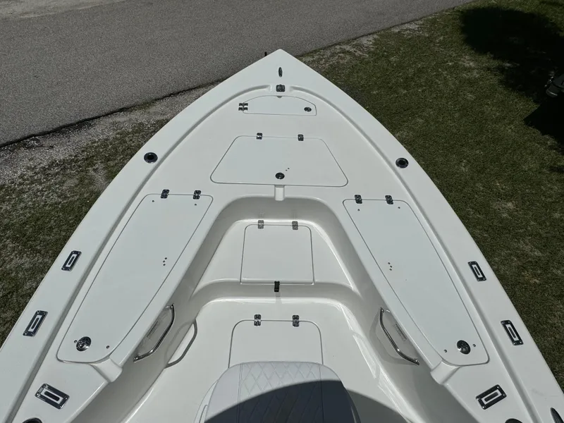 Slide: The Image of 2024 Sea Pro 230 Bay boat bow with storage compartments. - 8