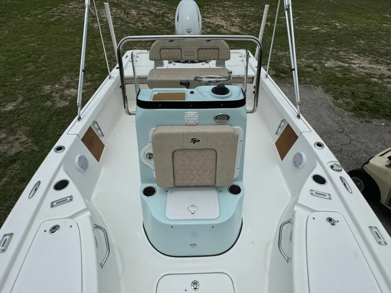Slide: The Image of 2024 Sea Pro 210 Bay boat interior with seating and console. - 11