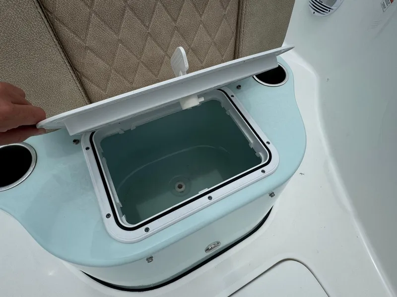 Slide: The Image of 2024 Sea Pro 210 Bay boat with open storage compartment. - 12