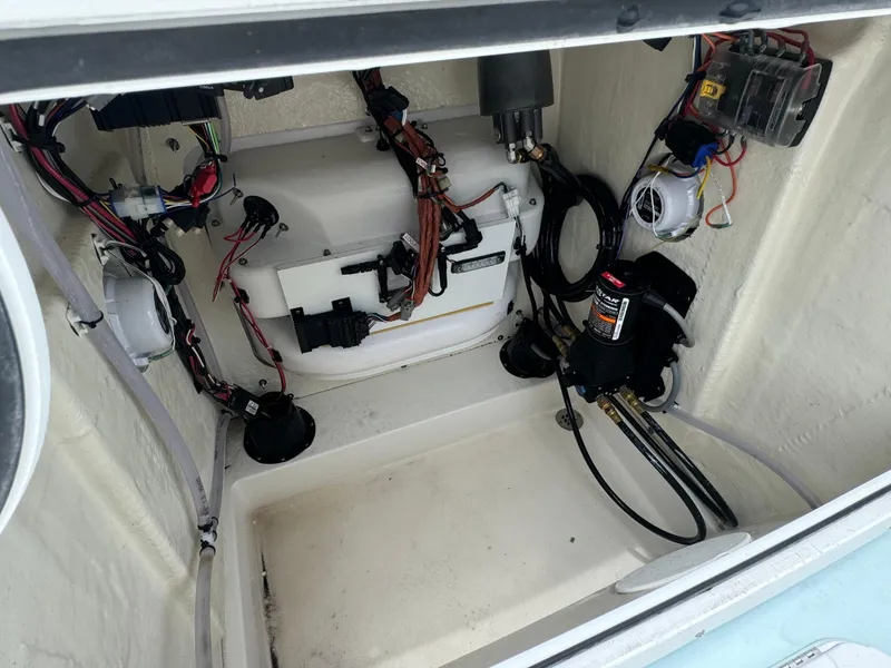 Slide: The Image of 2024 Sea Pro 210 Bay boat interior wiring and components. - 14