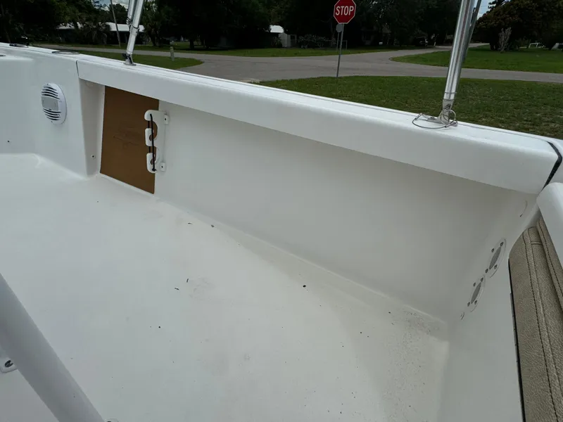 Slide: The Image of 2024 Sea Pro 210 Bay boat interior, white deck and side panel. - 25