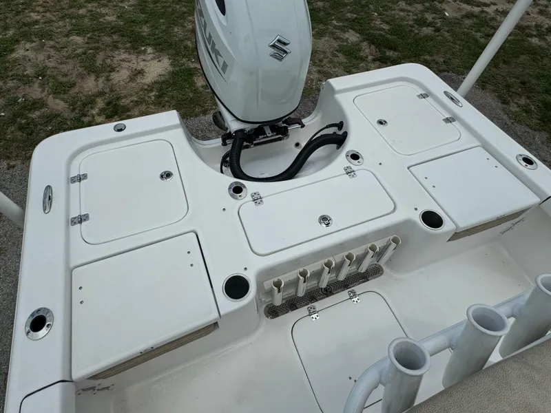 Slide: The Image of 2024 Sea Pro 210 Bay boat with Suzuki outboard motor, rear deck view. - 26