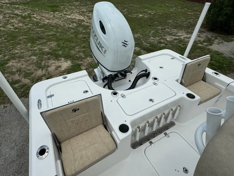 Slide: The Image of 2024 Sea Pro 210 Bay boat with Suzuki outboard motor and beige seating. - 27