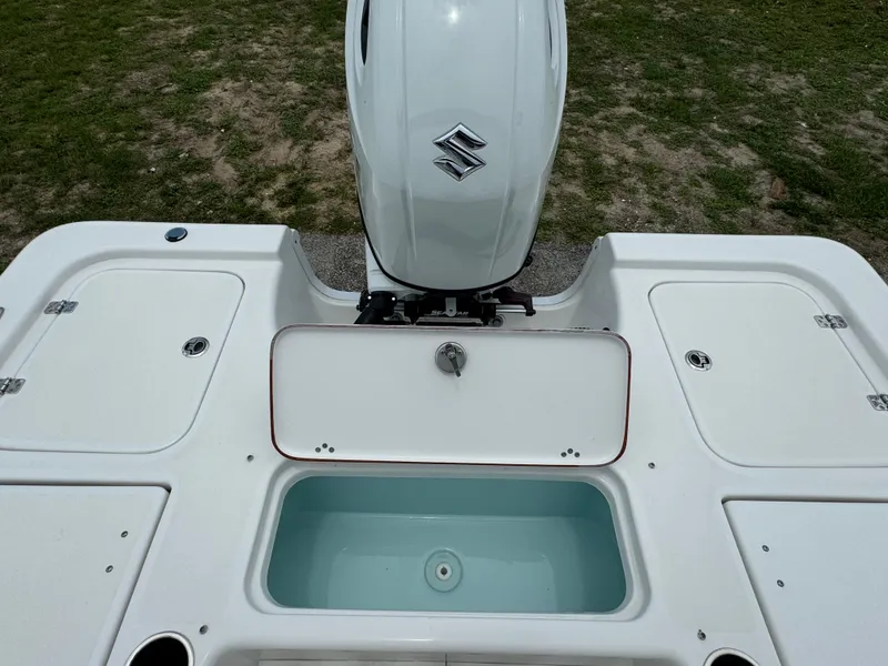 Slide: The Image of 2024 Sea Pro 210 Bay boat with Suzuki outboard motor and livewell. - 32