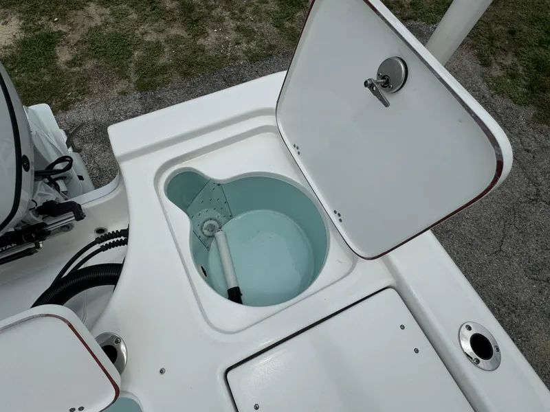 Slide: The Image of 2024 Sea Pro 210 Bay boat livewell and storage compartments. - 33