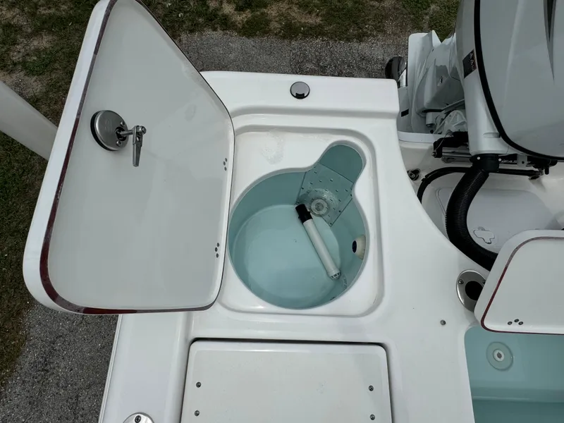 Slide: The Image of 2024 Sea Pro 210 Bay boat livewell and storage compartment. - 34