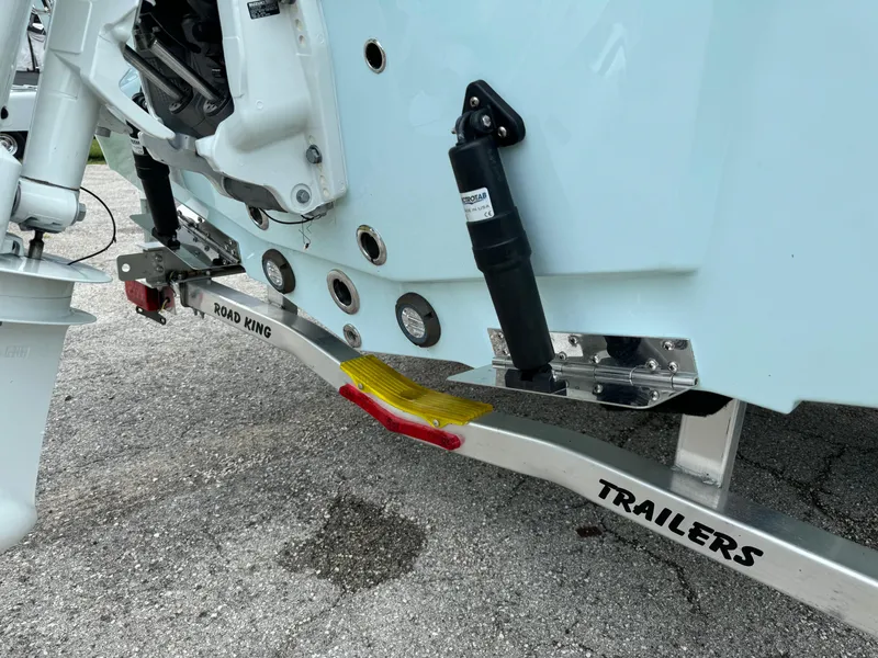 Slide: The Image of 2024 Sea Pro 210 Bay boat on Road King trailer, close-up of the stern and motor mount. - 35