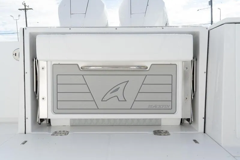 Slide: The Image of 2024 Blackfin 272 DC boat with sleek storage compartment design. - 11