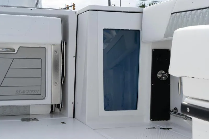 Slide: The Image of 2024 Blackfin 272 DC boat interior detail with storage compartments. - 13