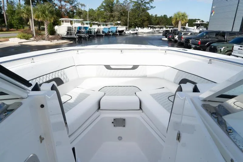 Slide: The Image of 2024 Blackfin 272 DC boat interior with white seating and modern design. - 17