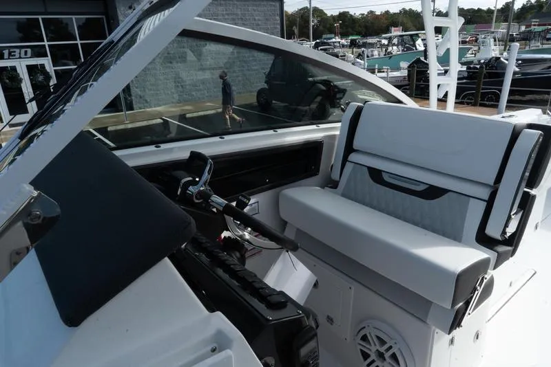 Slide: The Image of 2024 Blackfin 272 DC boat interior with modern seating and controls. - 21