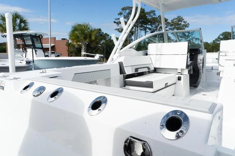 Slide: The Image of 2024 Blackfin 272 DC boat interior with seating and rod holders. - 23