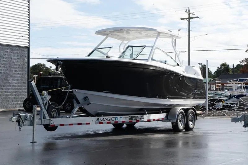 Slide: The Image of 2024 Blackfin 272 DC boat on trailer in parking lot. - 5