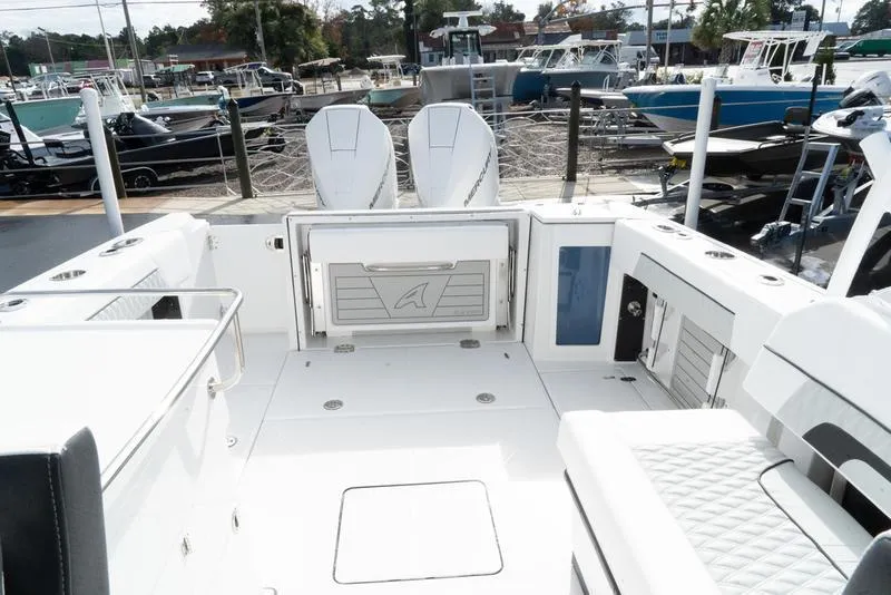 Slide: The Image of 2024 Blackfin 272 DC boat interior with dual engines, spacious deck, and modern design. - 6